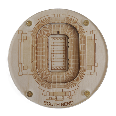 Wooden model of a stadium layout with 'South Bend' engraved on it, on a white background.