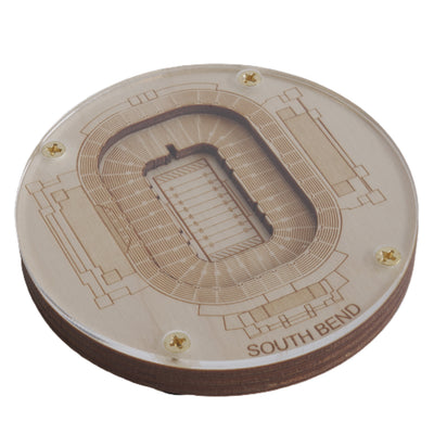 Wooden model of a stadium layout with 'South Bend' engraving on a white background
