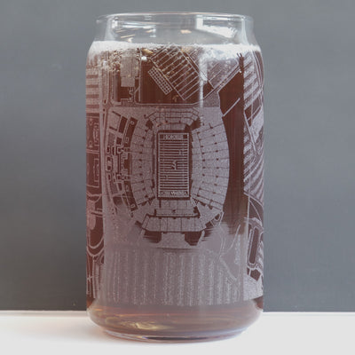 Clear glass can with architectural design on a black background